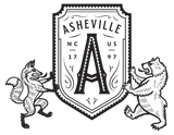 close up of  t-shirt of bear and fox holding a shield with "A" for Asheville, North Carolina