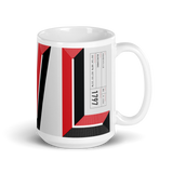 White coffee mug with "AVL" and Asheville statistics printed on it.